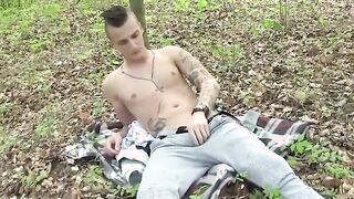 Inked European Jock Rubbing His Feet And Penis Into The Woods