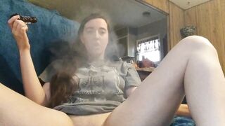 Stoner Babe Smokes And Plays With Her Pussy In The Living Room