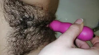 Hairy Pussy Plays With A Vibrator And Gets An Orgasm In The Bathroom