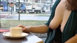 Horny Milf Sitting With Naked Boobs In The Cafe And Drinking Coffee