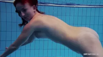 Athletic Redhead Strips Naked In The Swimming Pool